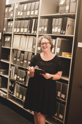 Archivist and Librarian, Sarah Ferguson, in the Archives